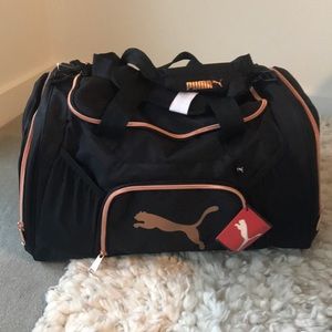 Puma women’s athletic duffel bag.